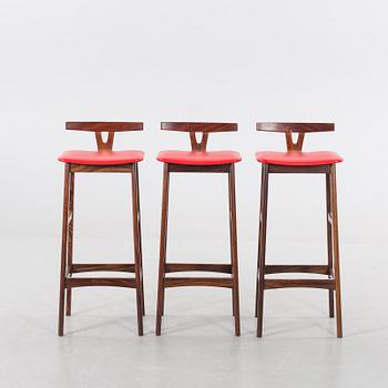 A danish 1960's Smith & Dyrlund bar with three barstools.