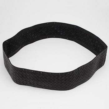 BOTTEGA VENETA, a black leather cover for the steering wheel.