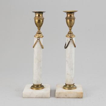 A pair of late Gustavian candle sticks.