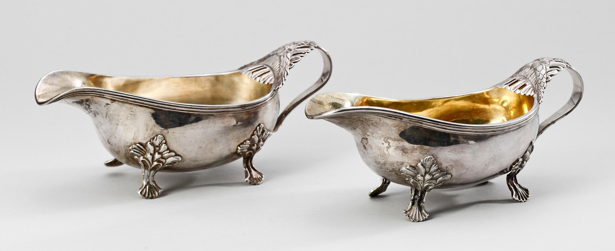 SÅSSNIPOR, ett par snarlika, silver, B.Erlandsson, Kristianstad 1911 resp John Pettersson eftr, Stockholm 1915. 534 gram.