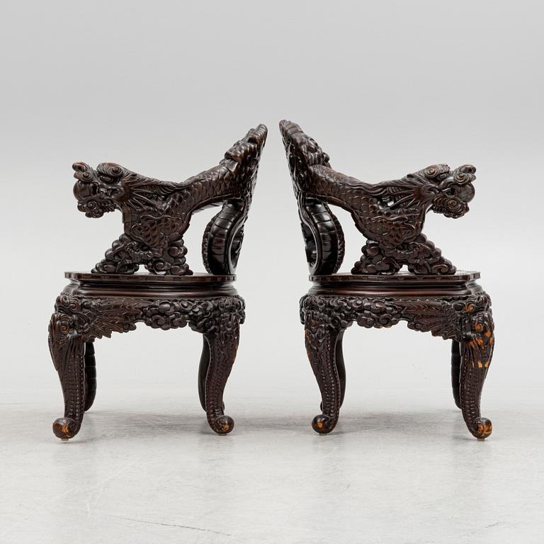 A pair of Chinese hardwood chairs, 20th century.