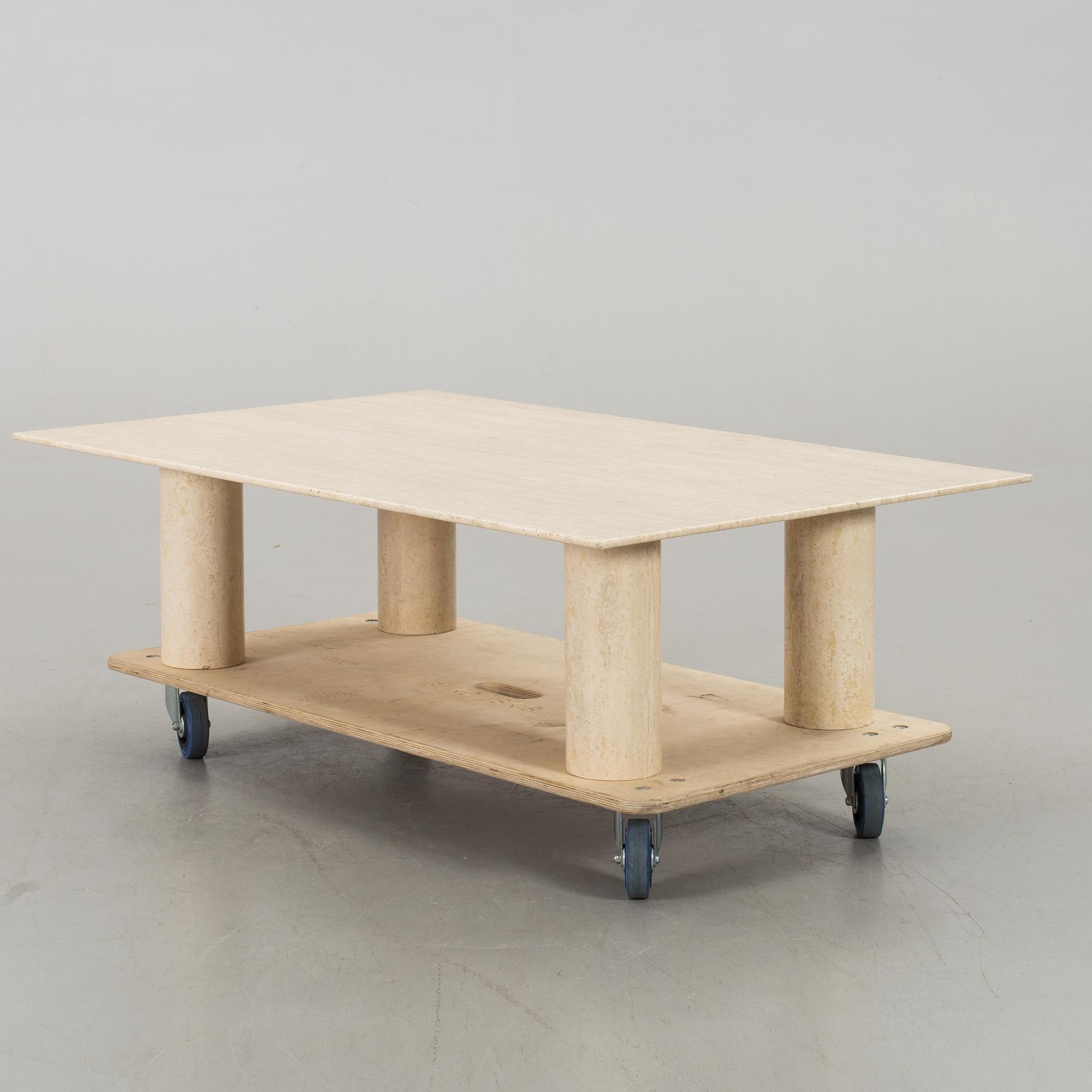 A TRAVERTINE SOFA TABLE.