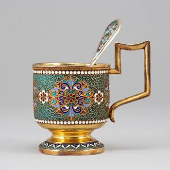 A Russian late 19th century silver-gilt and enameld tea-glass holder, unidentified makers mark, Moscow 1895.