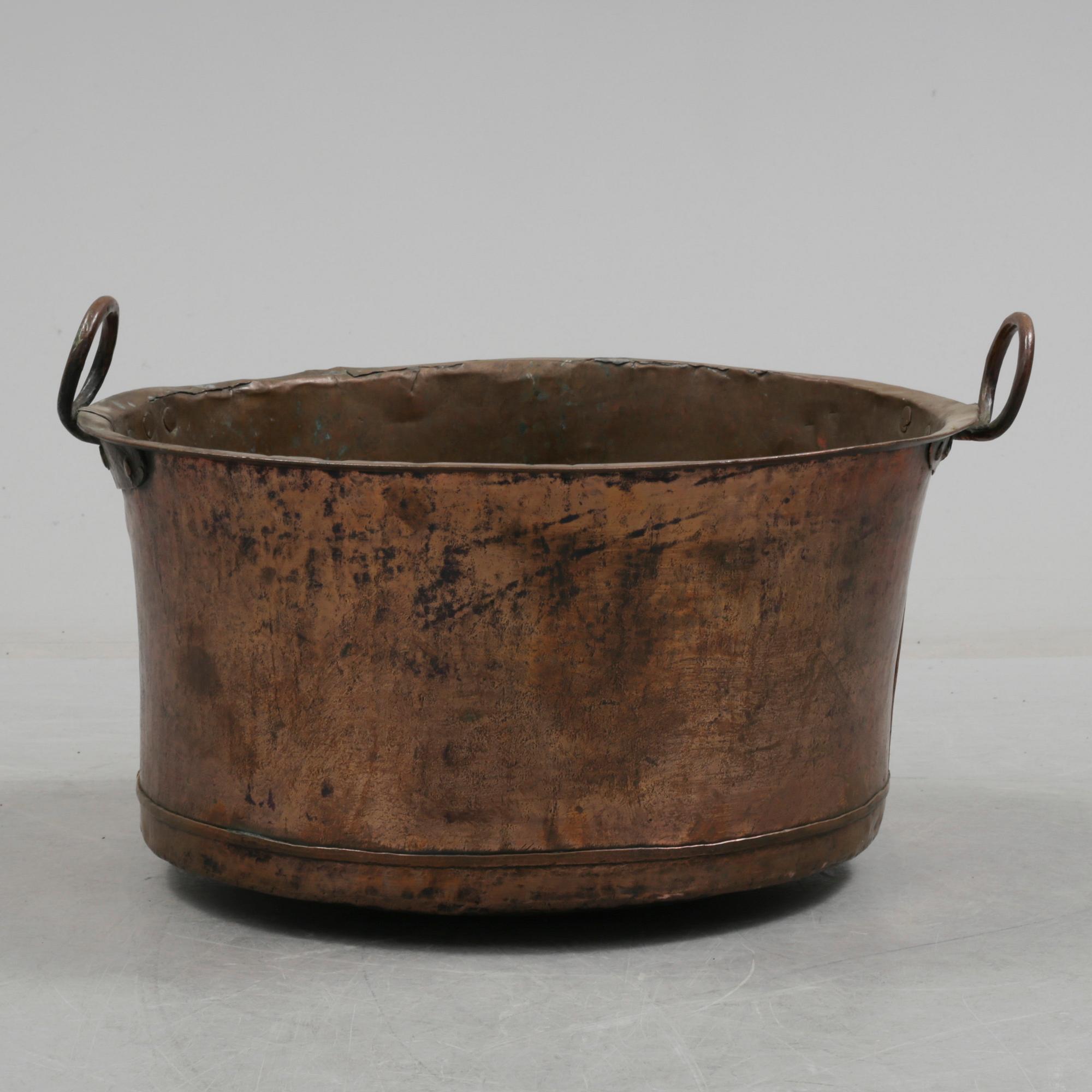A 19th century copper cauldron.