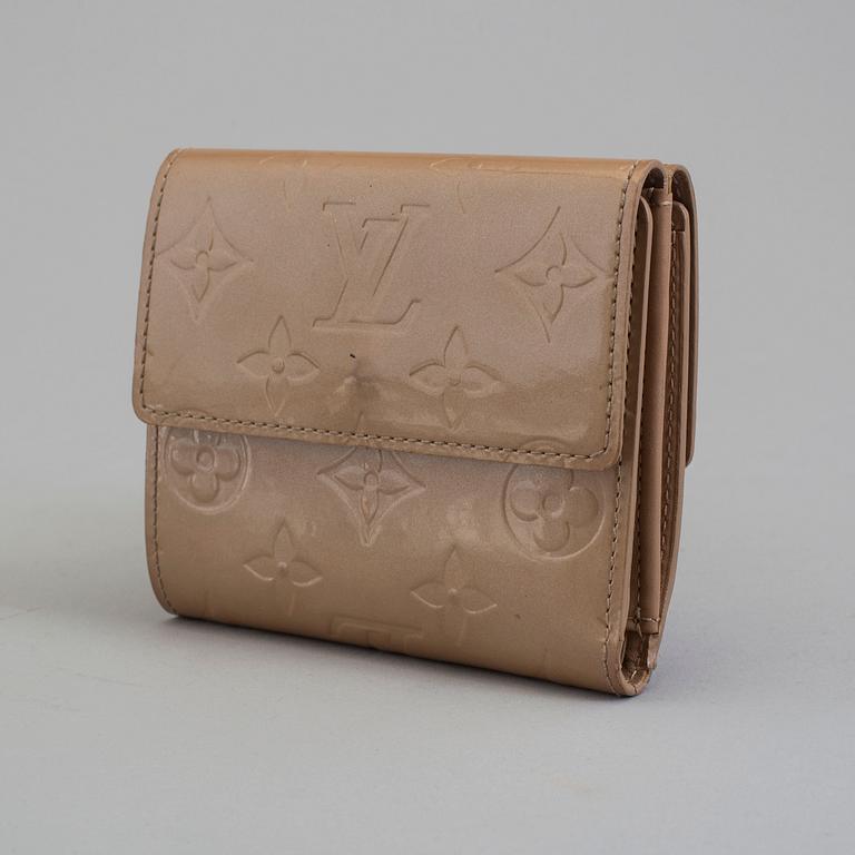 A beige monogram vernis wallet by Louis Vuitton.