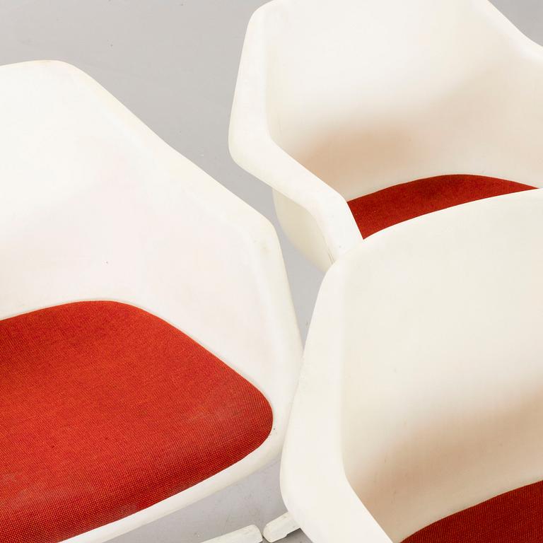 Six Robin Day armchairs.