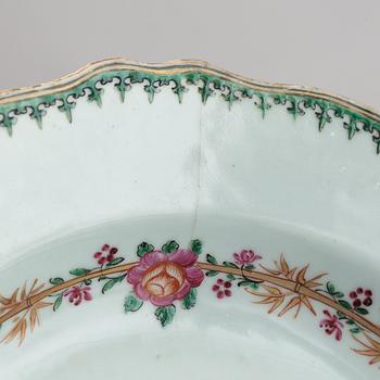 A pair of armorial dinner plates and a group of three odd famille rose plates, Qing dynasty, Qianlong (1736-95).