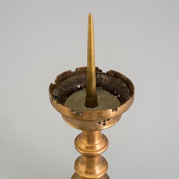 A GOTHIC STYLE BRONZE CANDLESTICK, 19th century.