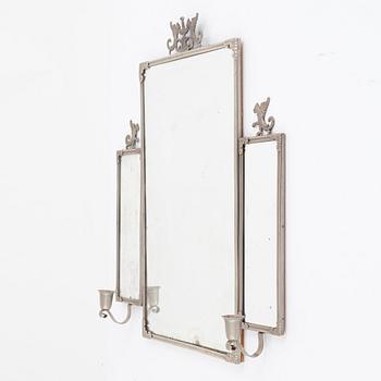 A Swedish Grace mirror and a pair of wall sconces, 1920's/30's.