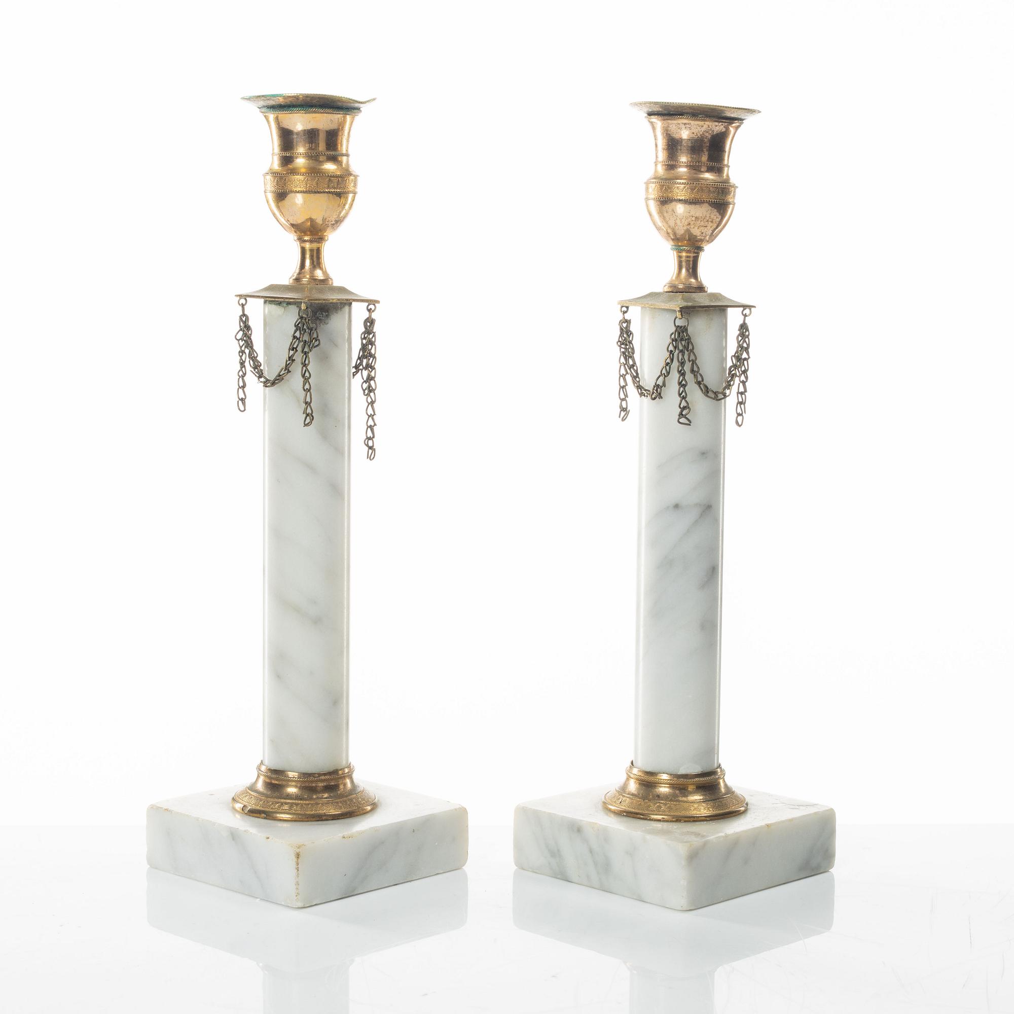 A pair of gilt-brass and marble late Gustavians candlesticks, late 18th century.