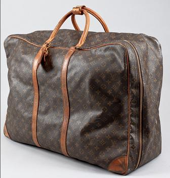 1363. A monogram canvas suitcase by Louis Vuitton.