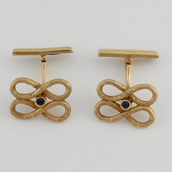 MANSCHETTKNAPPAR, ett par, 18k guld med små safirer. Vikt ca 9 gram.