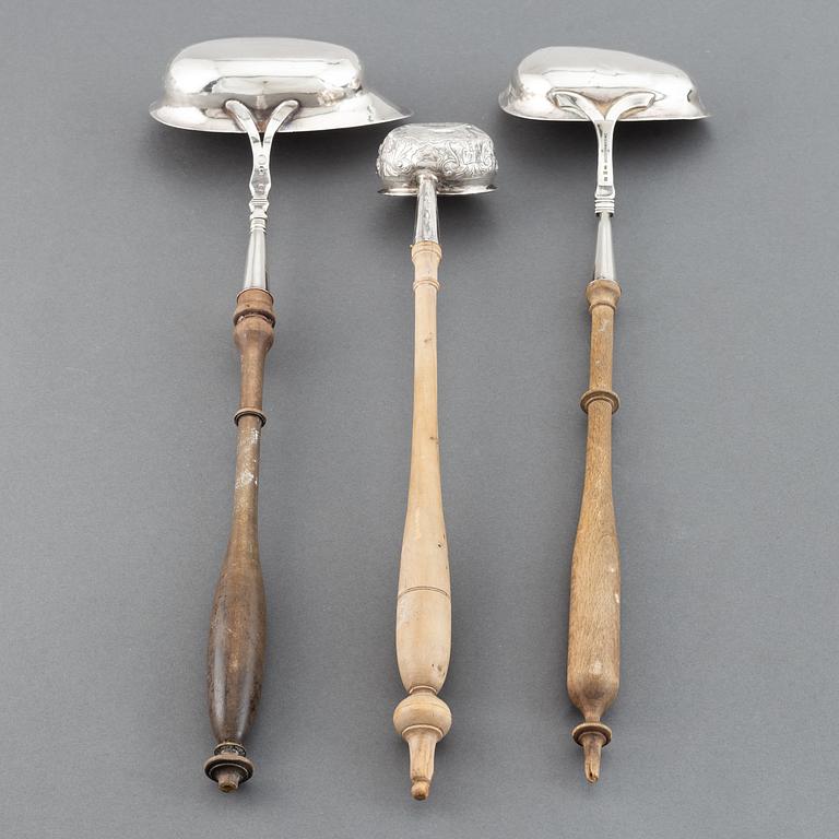 Two 19th century Swedish silver soup-ladles and a silver brandy-ladle.