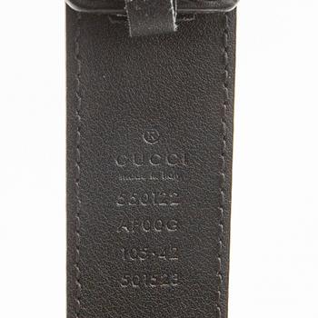 Gucci, belt and shawl.