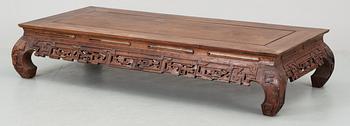 A wooden Chinese low table, 20th Century.