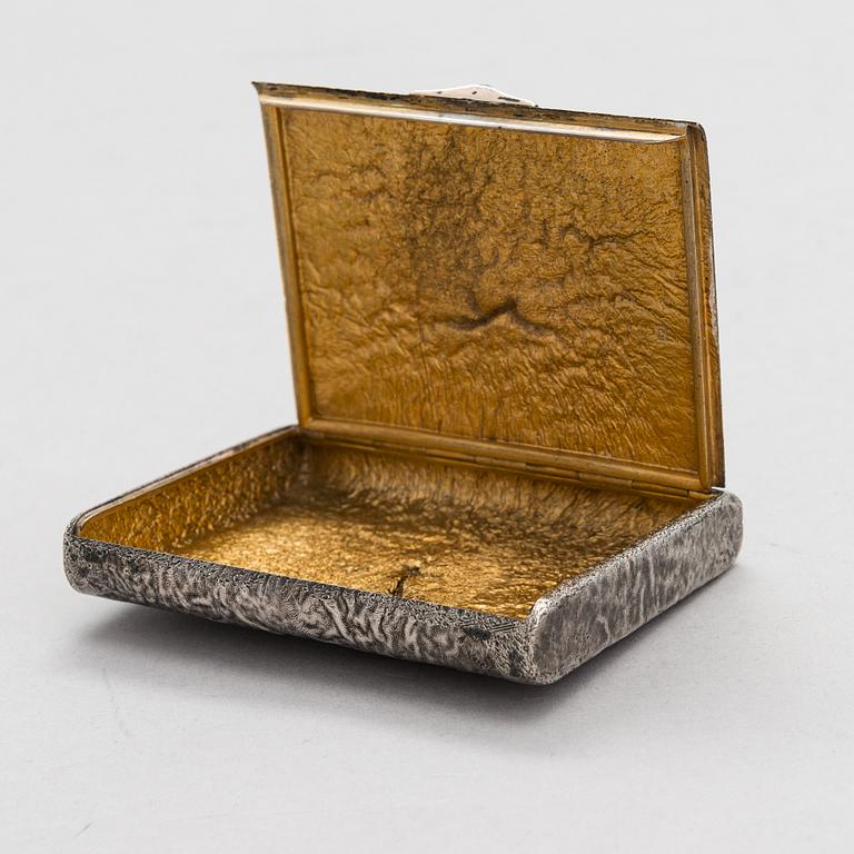 A Russian, early 20th century silver cigarette case, samorodok technique.