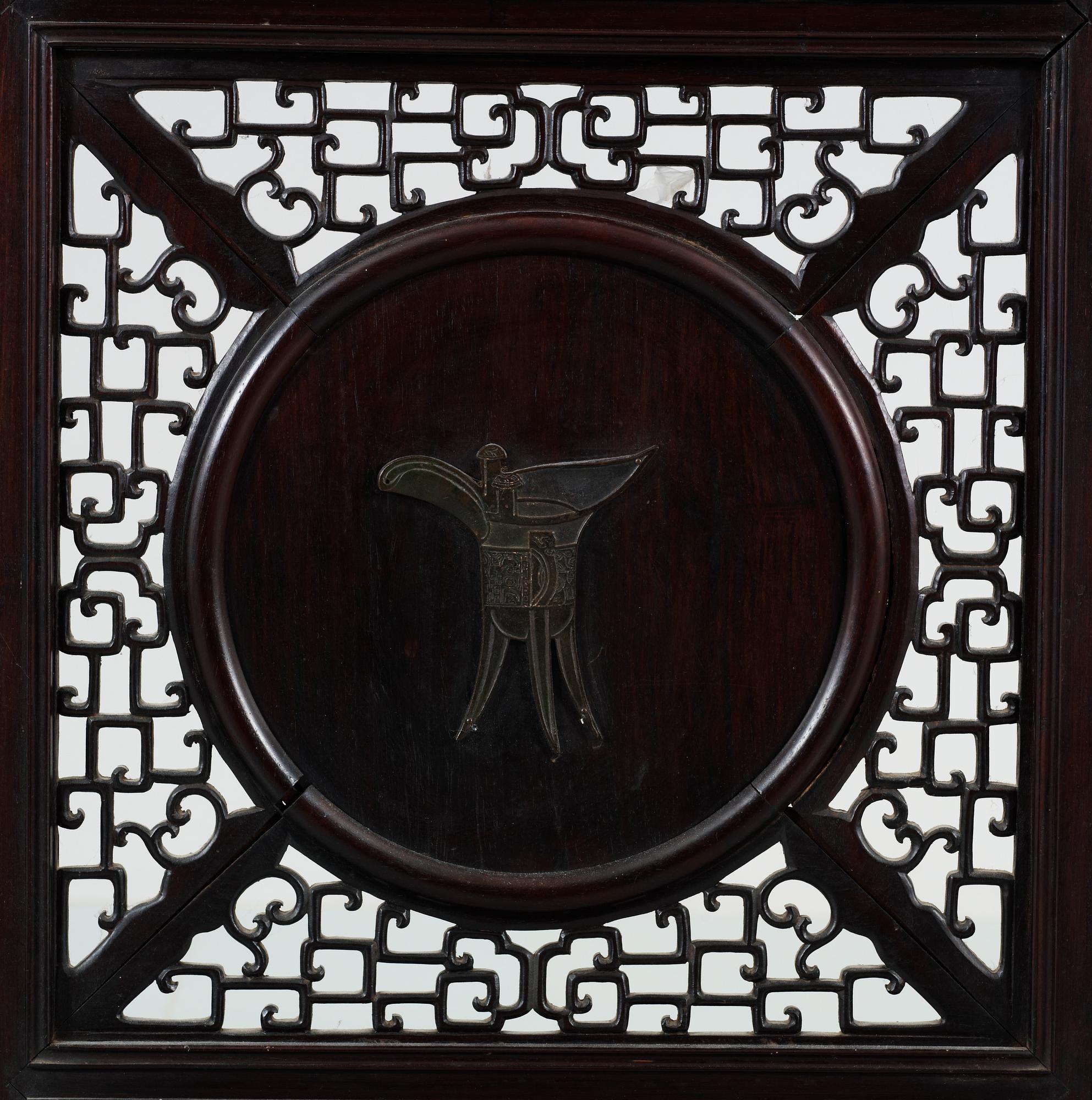 A four panel screen with porcelain placques, Qing dynasty, 19th Century.