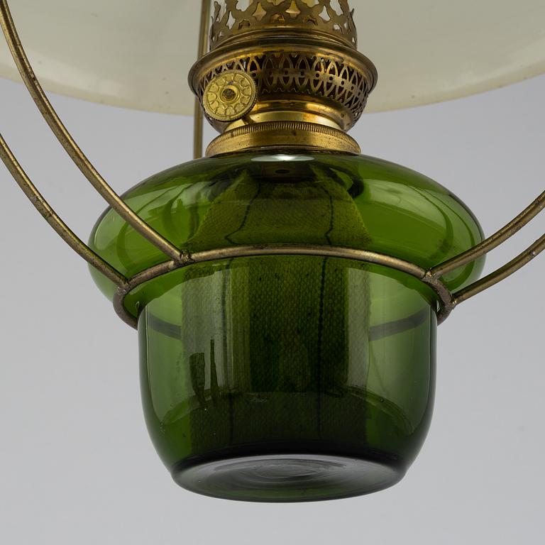 a paraffin ceiling light, brass and glass.