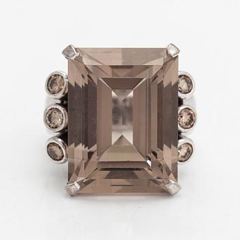 An 18K whitegold ring with an emeraldcut smokey quartz and diamonds approx 0.70 ct in total, Kultala, Helsinki 2008.