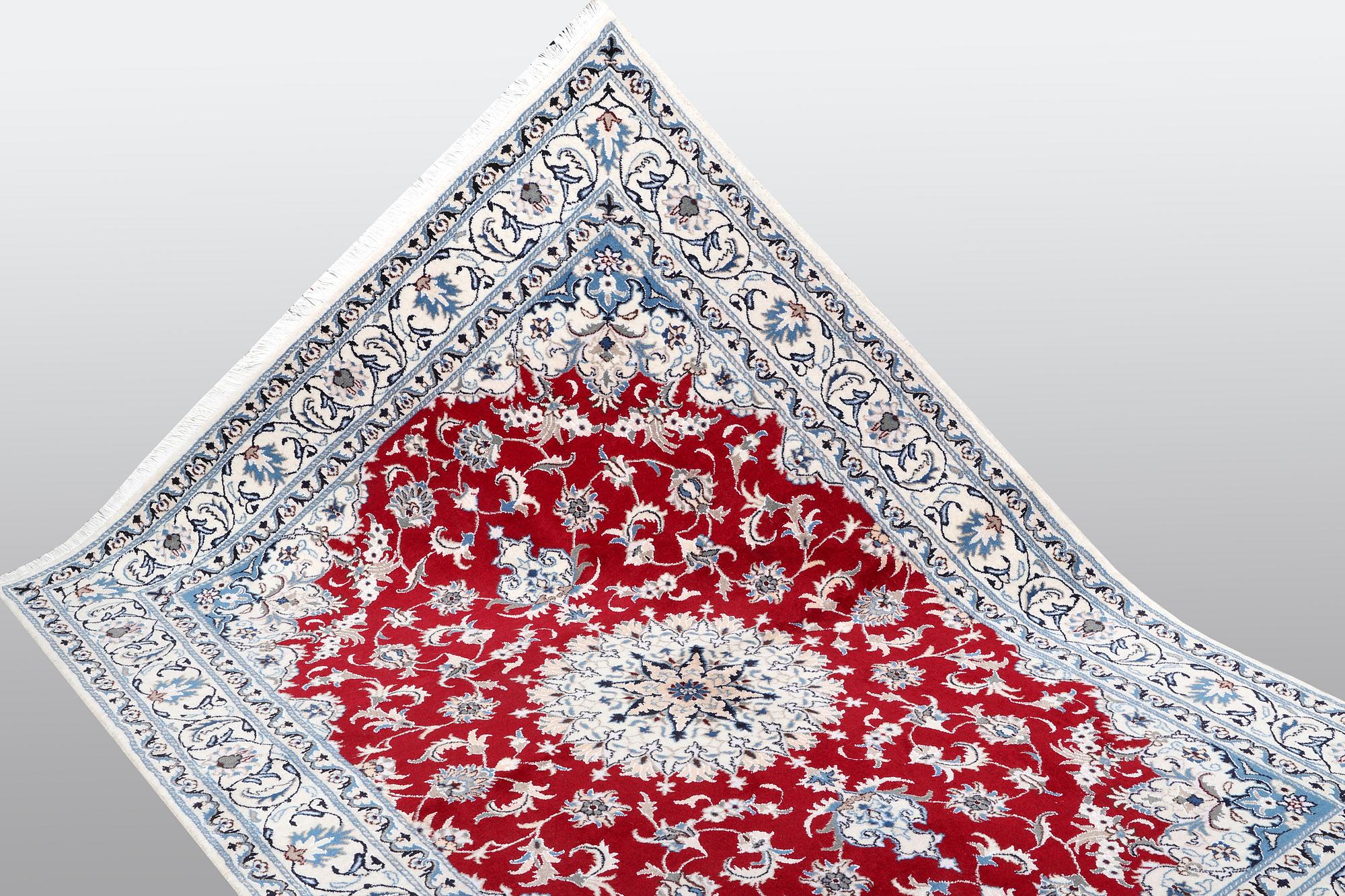 A carpet, Nain, part silk, ca 238 x 170 cm.