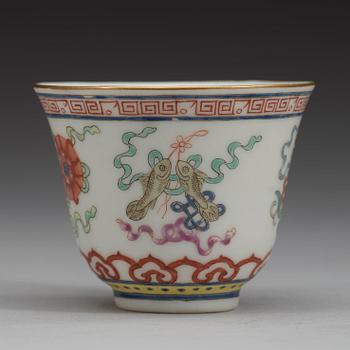 A set of eleven famille rose ba jixiang wine cups, Qing dynasty, with Guangxu six character mark and period (1874-1908).