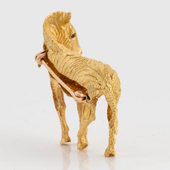 A Tiffany brooch in 18K gold set with sapphires designed as a zebra.