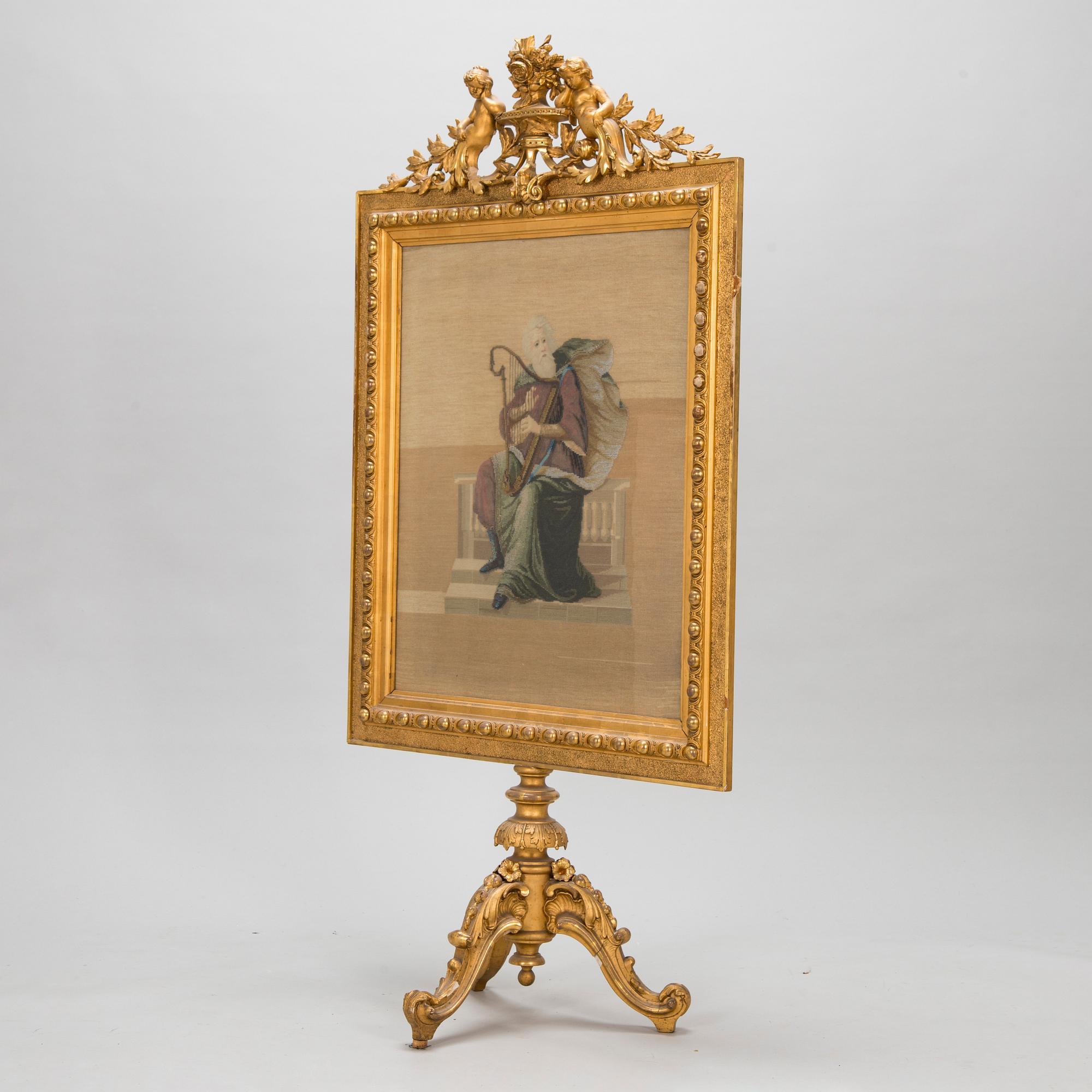 A late 19th century fire screen.