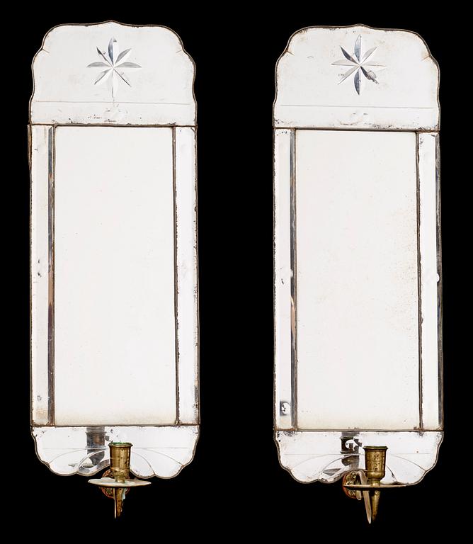 A pair of Swedish Rococo 18th century one-light girandole mirrors.