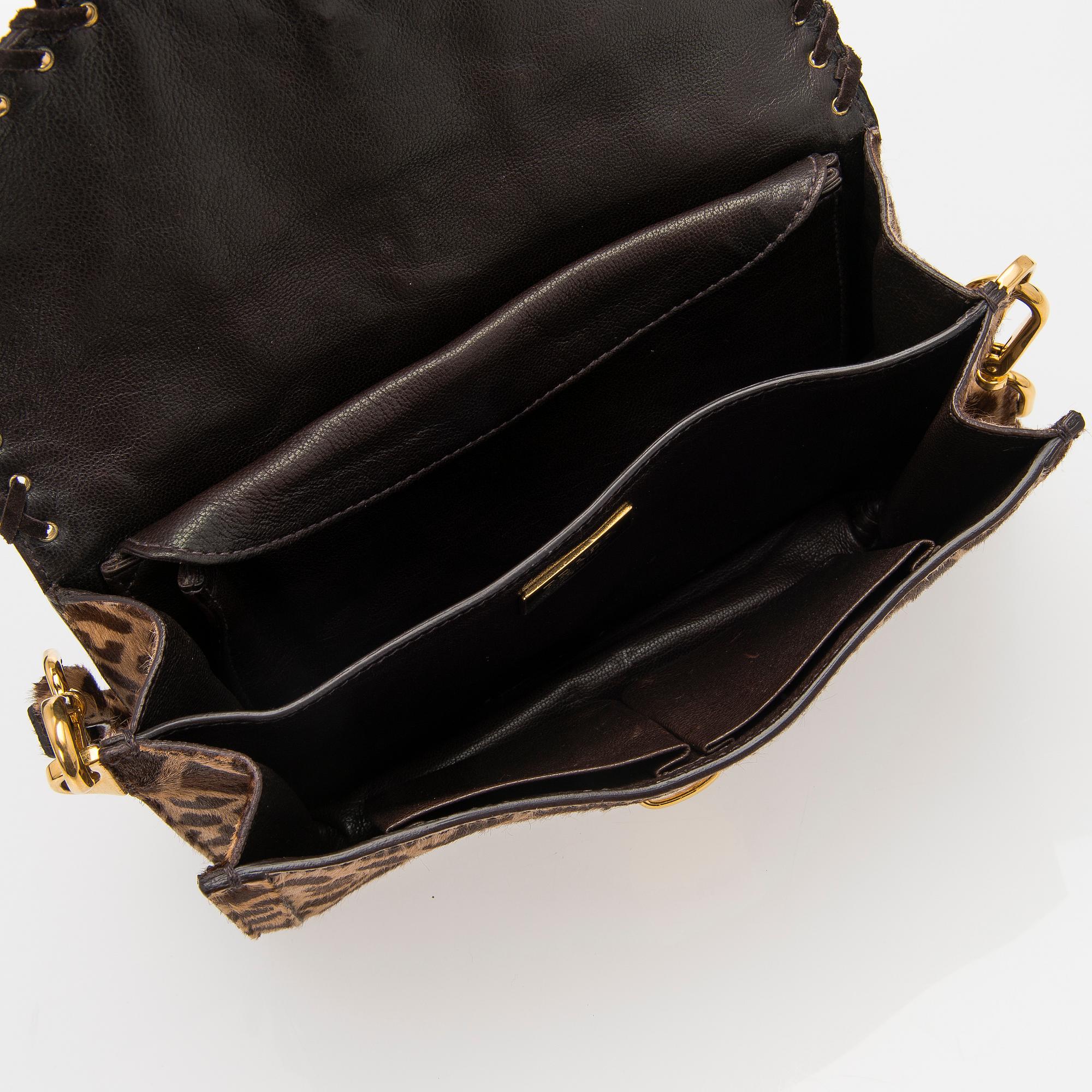 An Animal Print Pony Hair Shoulder Bag.