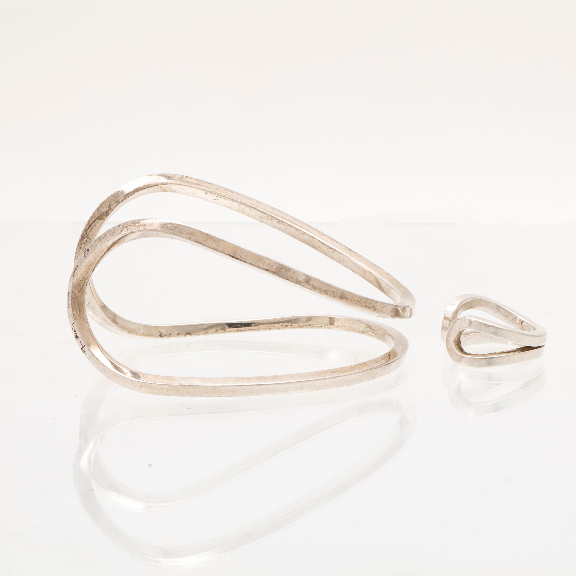 A silver ring and bracelet "loop cuff" by Efva Attling.