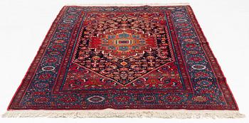 An oriental rug, old, c. 204 x 139 cm.
