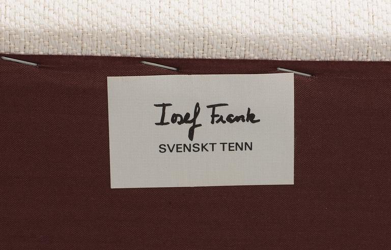 A Josef Frank armchair and ottoman, Svenskt Tenn.