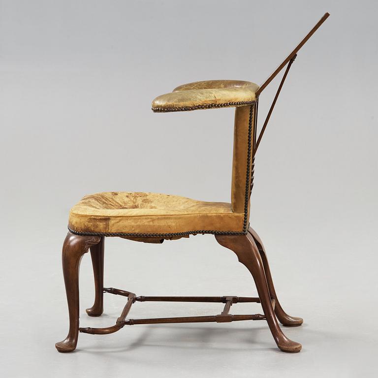 An English 18th century reading and writing chair.