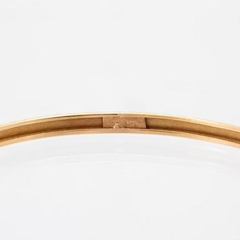 A pair of 18K gold bracelets for children.