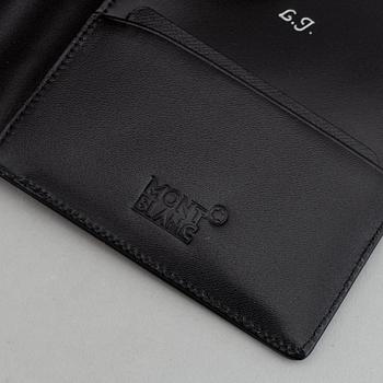 MOntblanc, a ball point pen and leather passport holder.