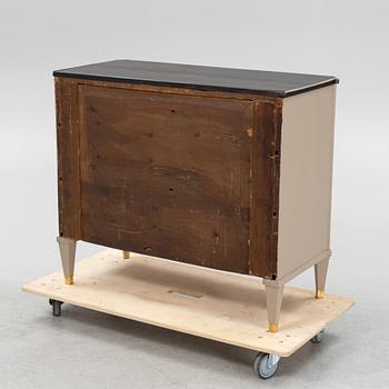A painted Gustavian style chest of drawers from around the year 1900.