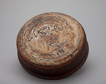 A CERAMIC CANDLESTICK.