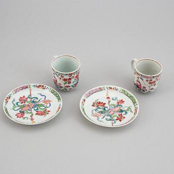 A pair of famille rose cups with dishes, Qing dynasty, Yongzheng (1723-35).