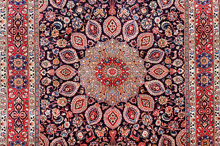 A Meshed carpet, c. 352 x 255 cm.