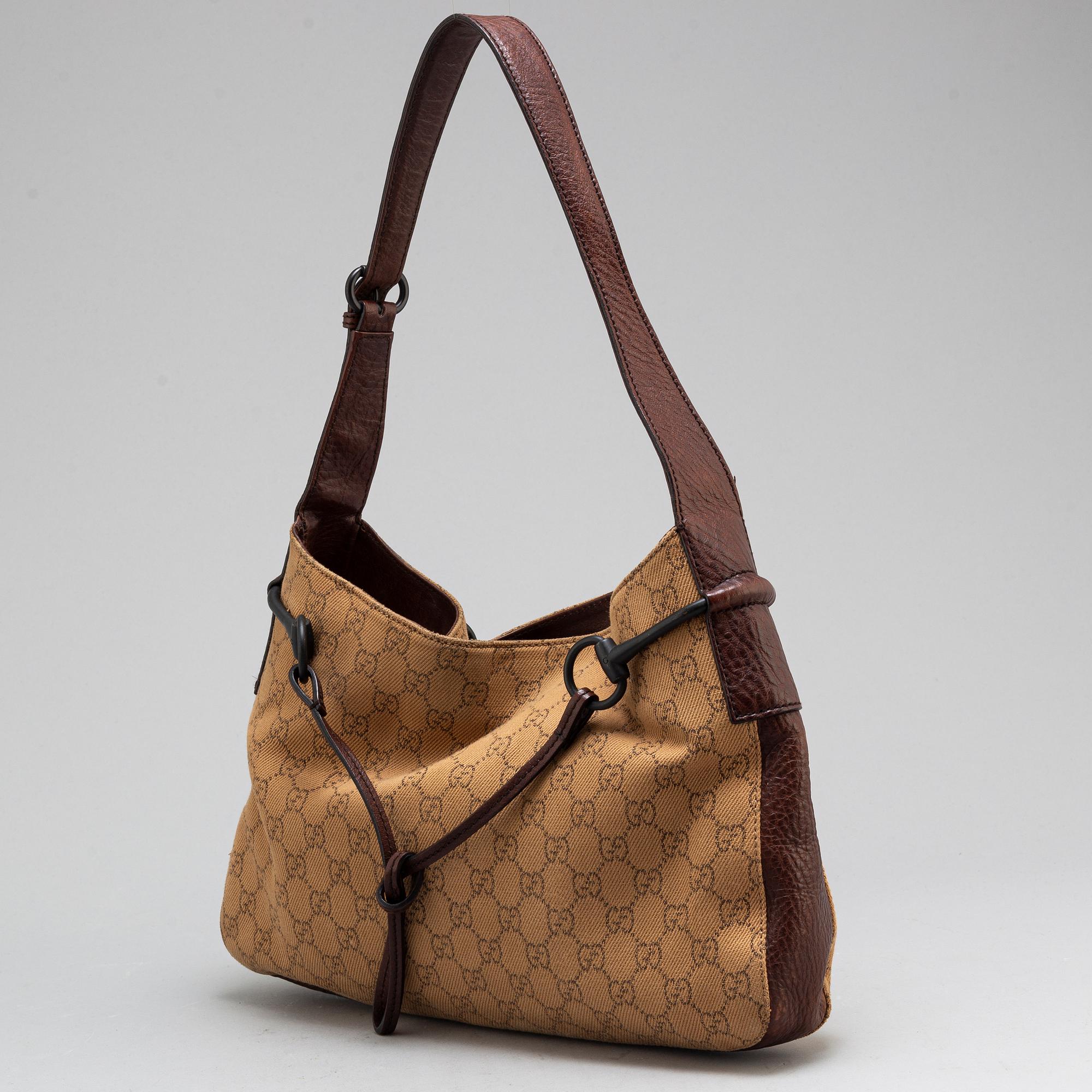 GUCCI, A canvas and leather bag.
