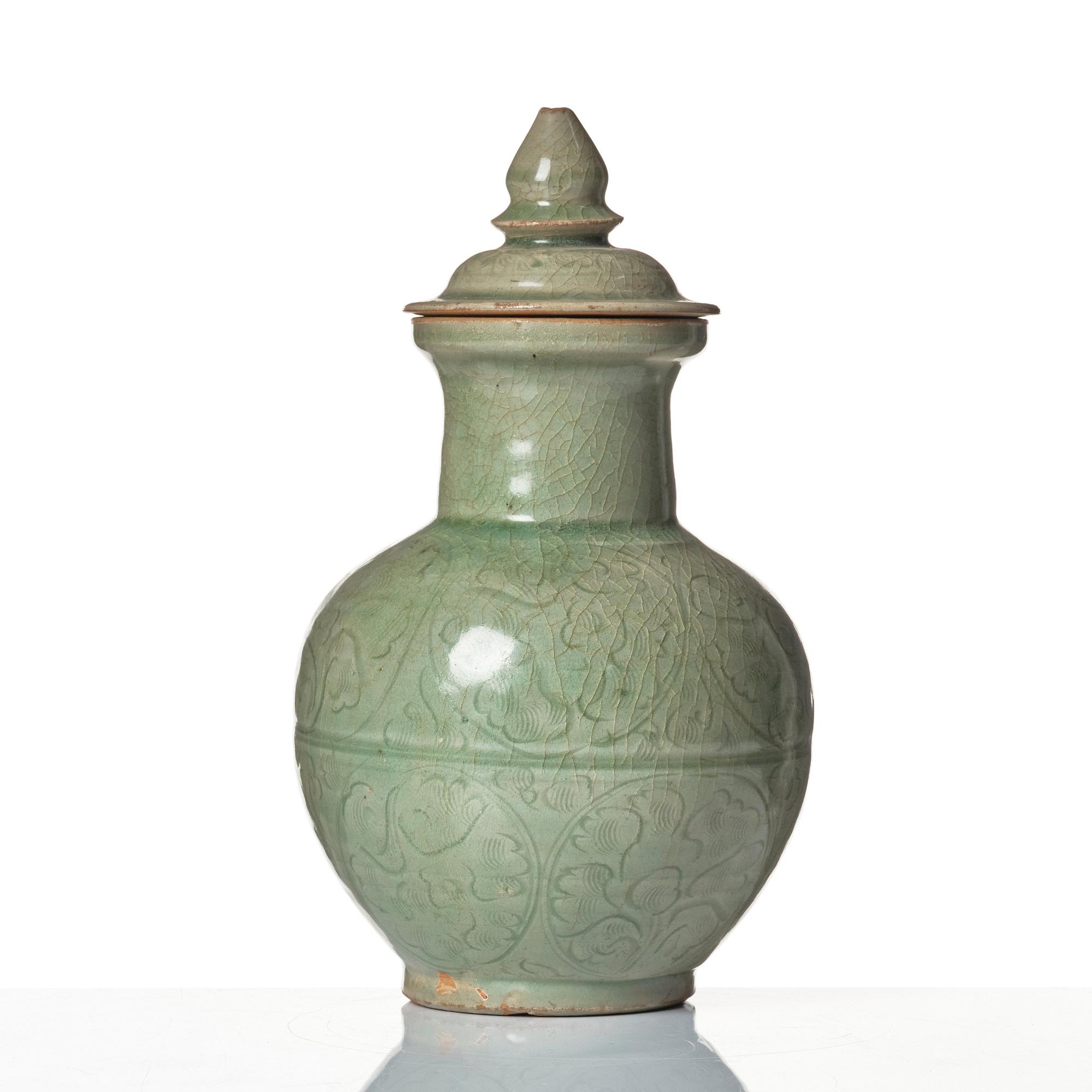 A celadon glazed jar with cover, Yuan dynasty (1271-1368).