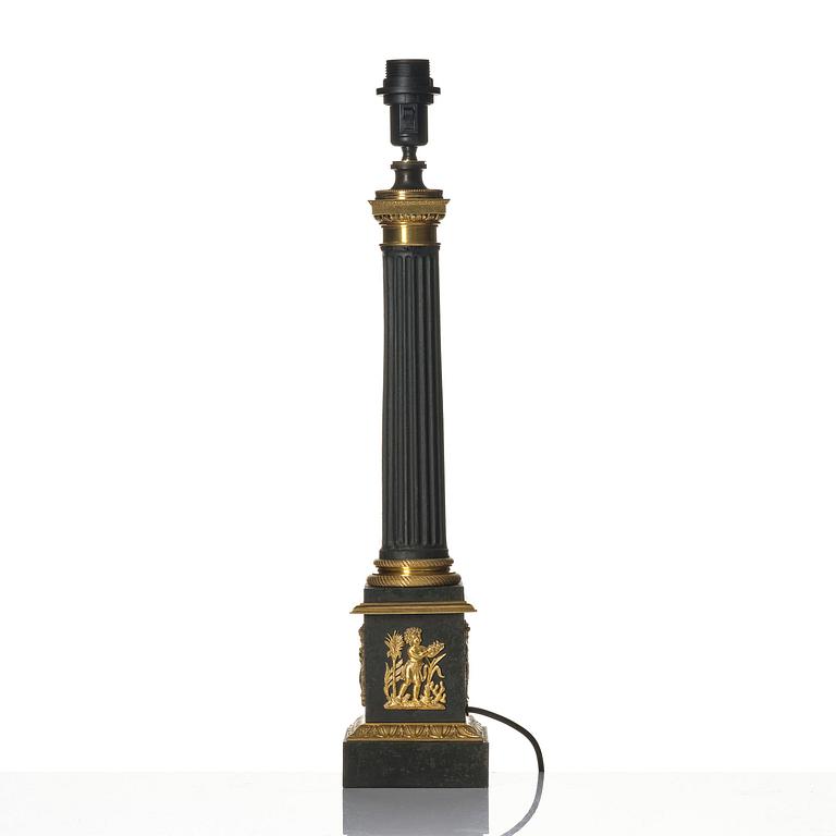 A French Empire ormolu and tole lamp, early 19th century.