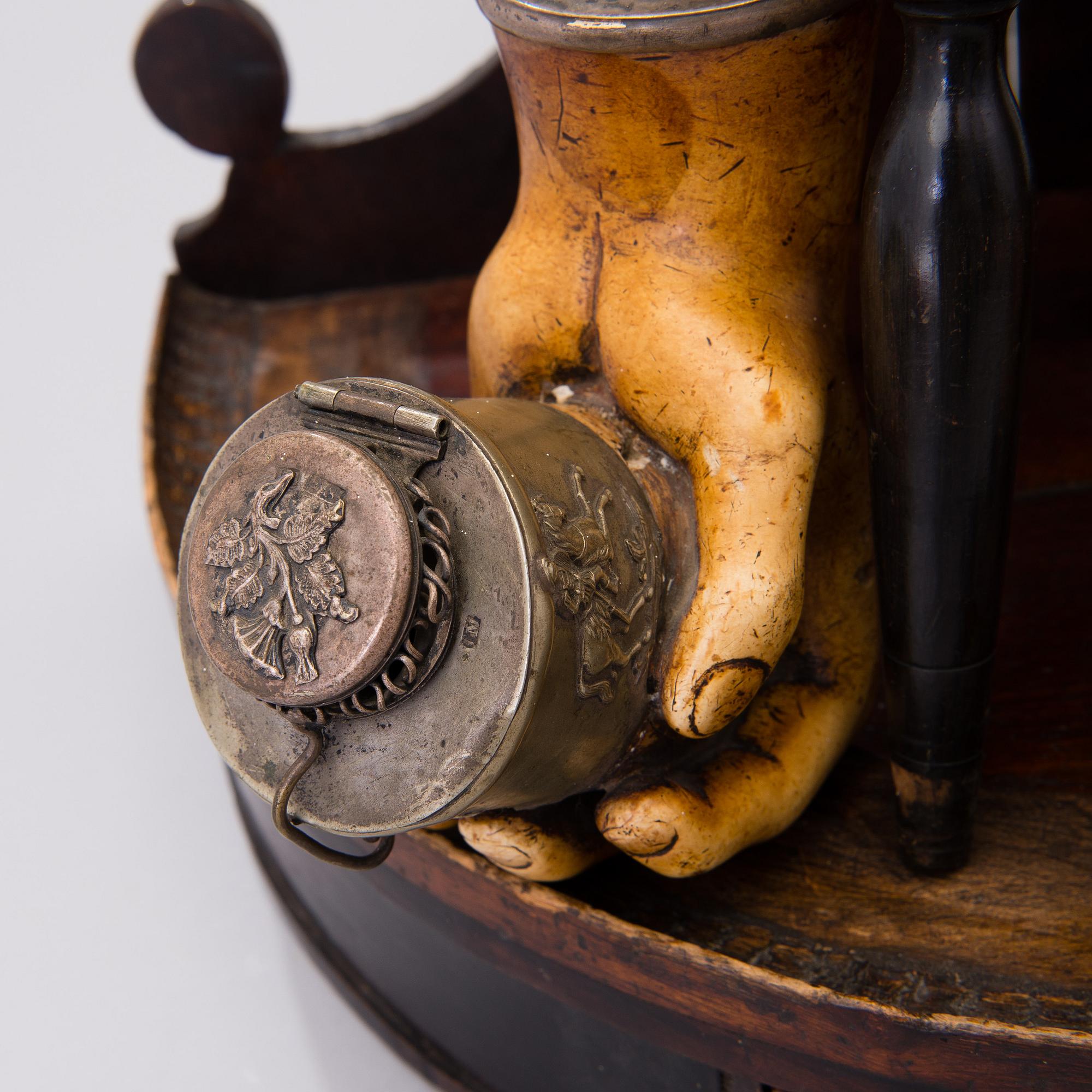 19th century pipes on a wooden pipe rack.