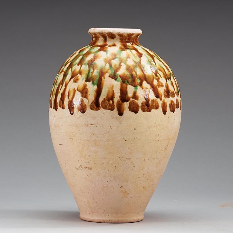 A Sancai-glazed pottery jar, Tang Dynasty (618-907).