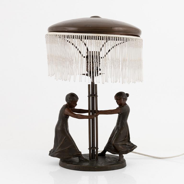 An Art Nouveau bronze table light, early 20th Century.