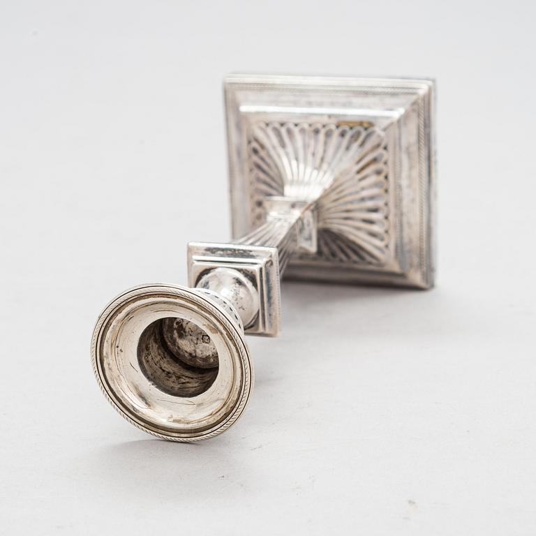 A late 19th-century sterling silver candlestick, maker's mark of William Hutton & Sons, London 1893.