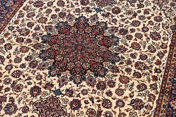 A semi-antique Isfahan carpet, Central Persia, signed (Ali) Seirafian, 328 x 250 cm.