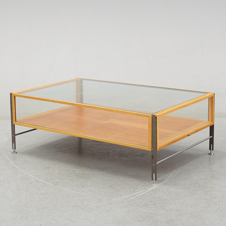 A glass top coffee table, late 20th Century.