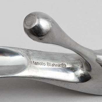 SKOSKED, vitmetall, Manolo Blahnik, 2000-tal.