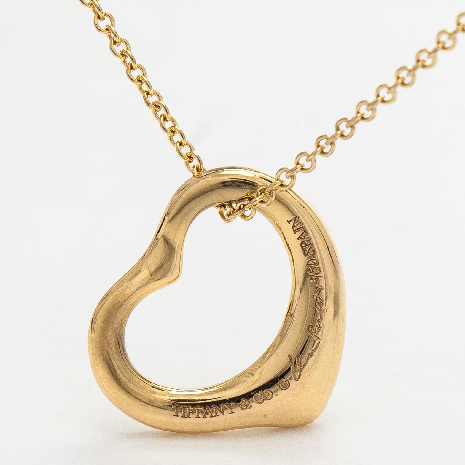 Tiffany & Co, Elsa Peretti, an 18K gold "Open Heart" necklace.